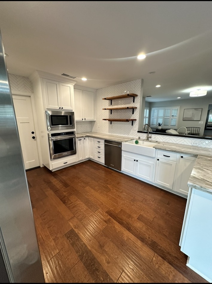 Bright residential kitchen with white cabinetry